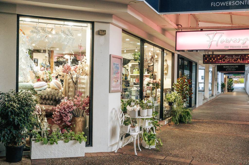 Tedder Avenue storefronts at dusk