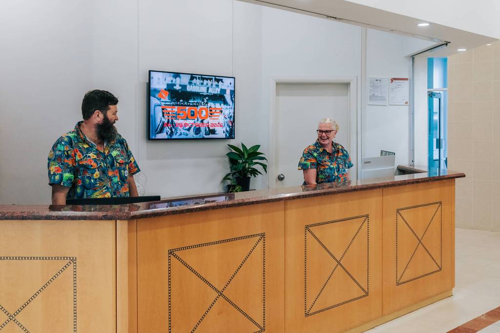 Managers Adam and Laura behind the reception desk