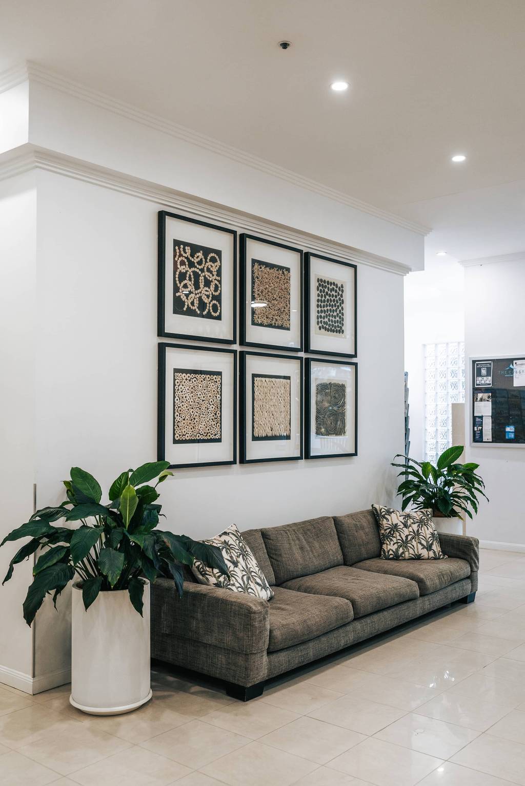 Reception lounge with sofa and gallery wall