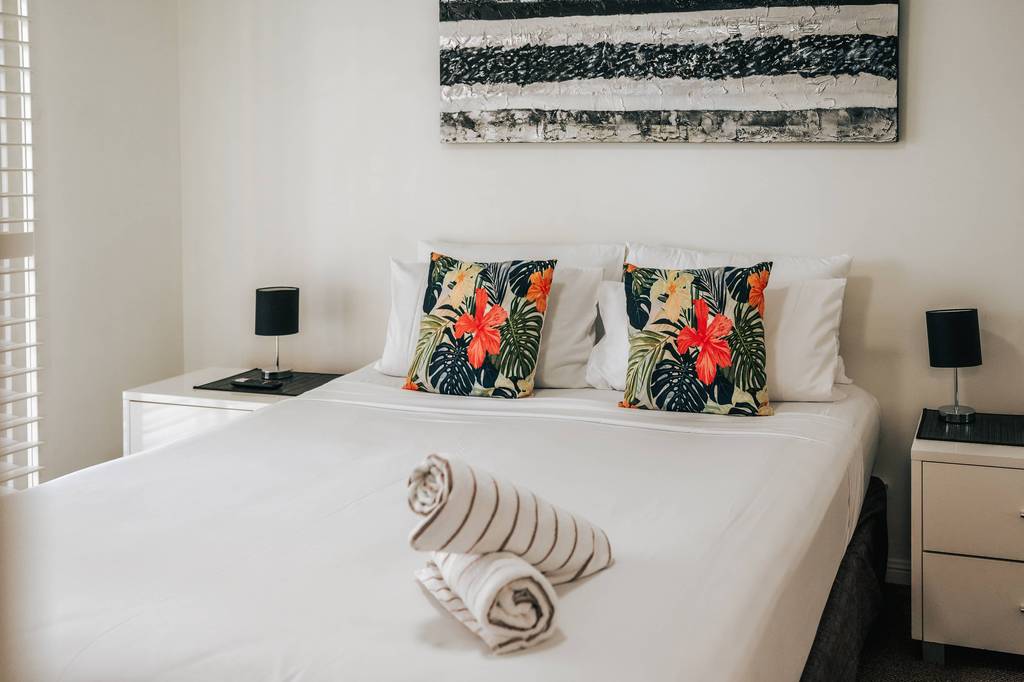 Bedroom with botanical cushions
