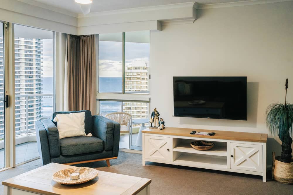 Lounge with ocean views through the balcony windows